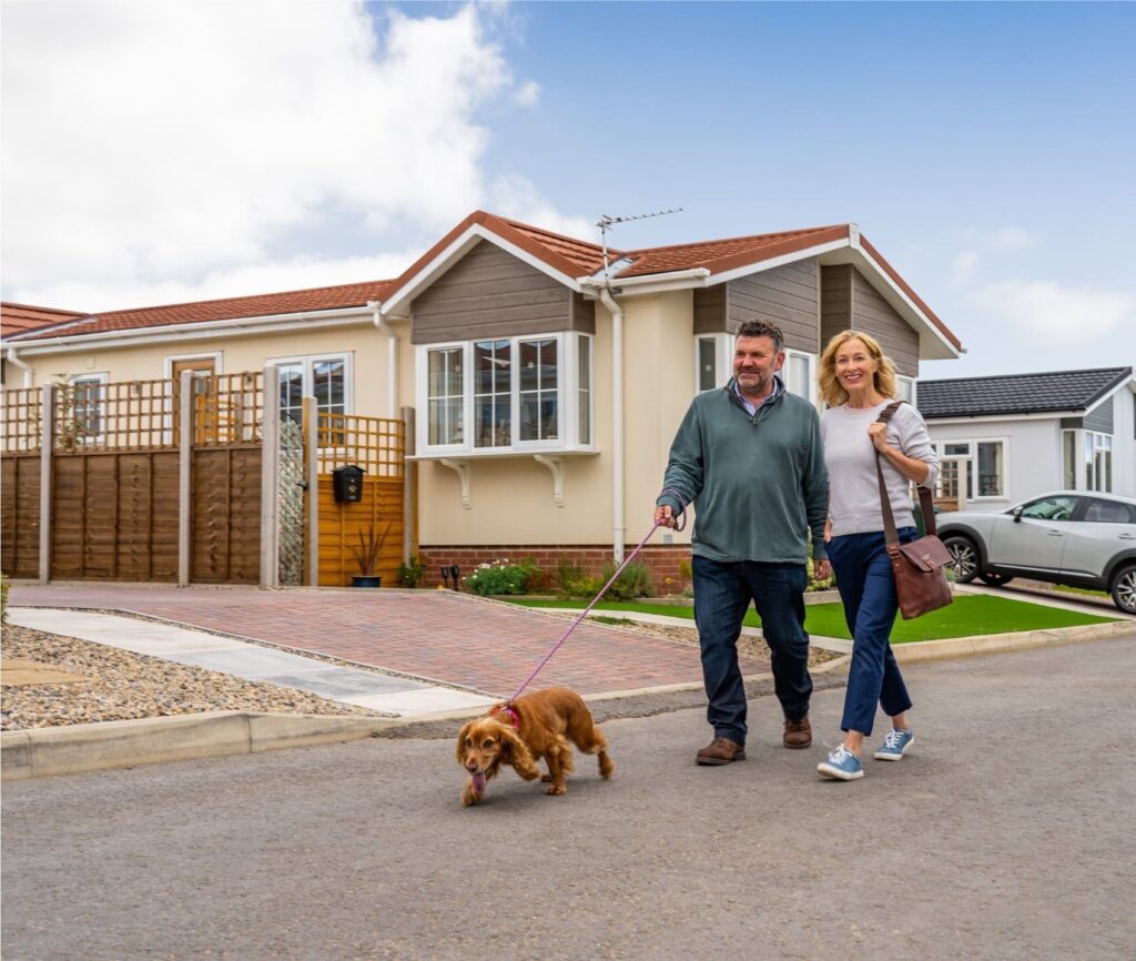 Couple walking dog